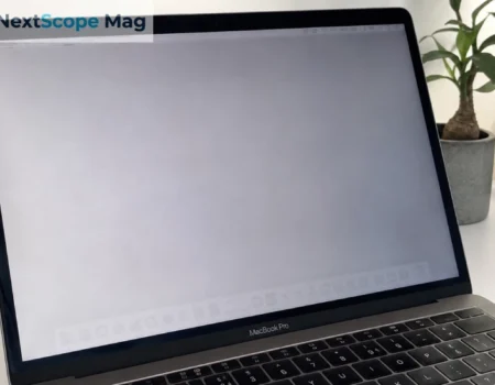MacBook Pro screen showing faint burn marks and ghost image retention on a gray background