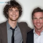 Thomas Boone Quaid standing with his father Dennis Quaid at a public event, both smiling at the camera
