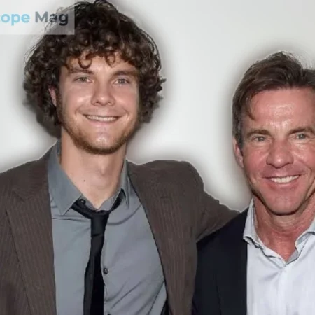 Thomas Boone Quaid standing with his father Dennis Quaid at a public event, both smiling at the camera