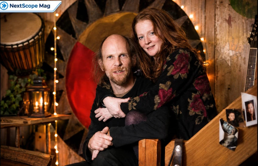 Geoff Dwight pictured with a woman in a rustic indoor setting in North Wales